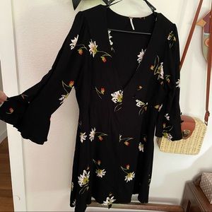 Women’s Free People Black Floral Wrap Mini Dress in size L